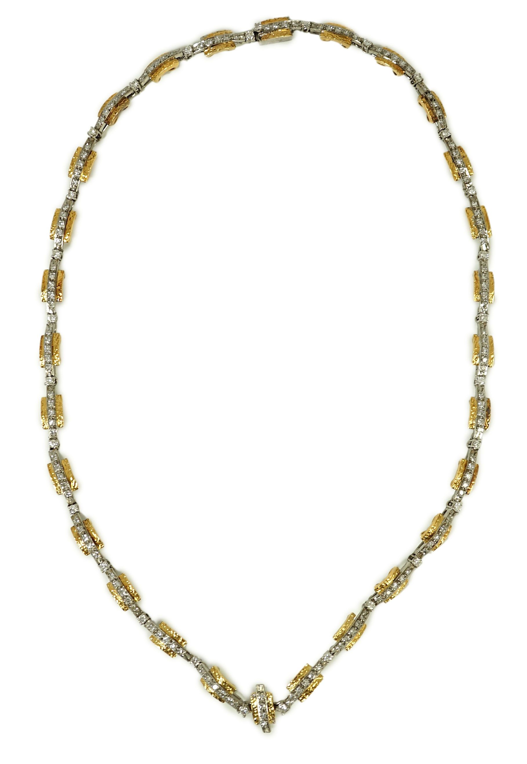 A 20th century two colour gold and diamond set necklace